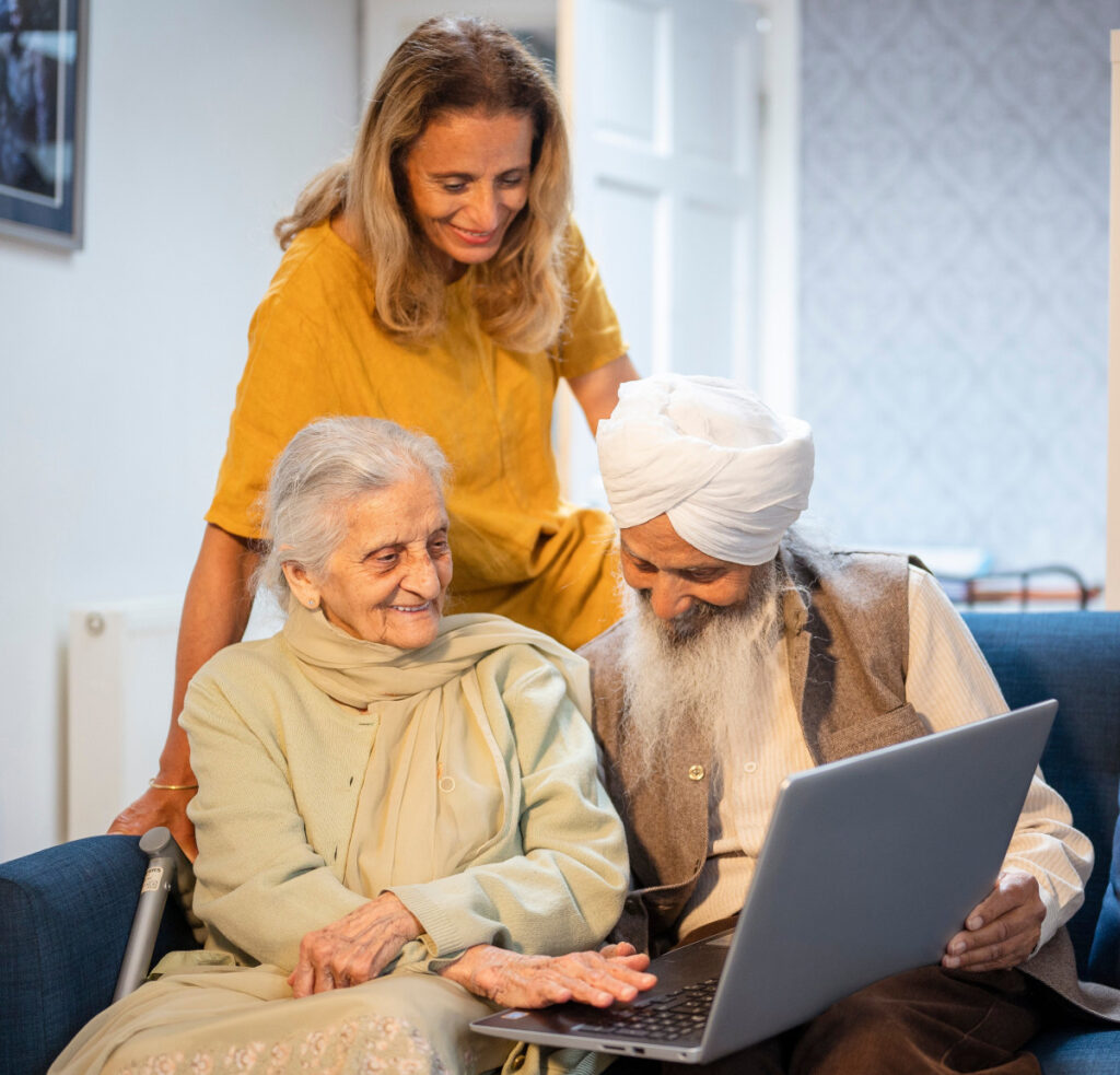 A photograph of a couple reviewing the Meals on Wheels UK website