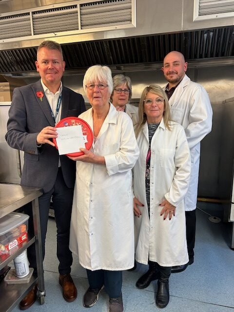 Andrew Stokes, Service Manager, and Stella Stewart, Hospitality Team Manager, delivering thank-you gifts to one of their local Meals on Wheels kitchens during last year’s National Association of Care Catering (NACC) National Meals on Wheels Week